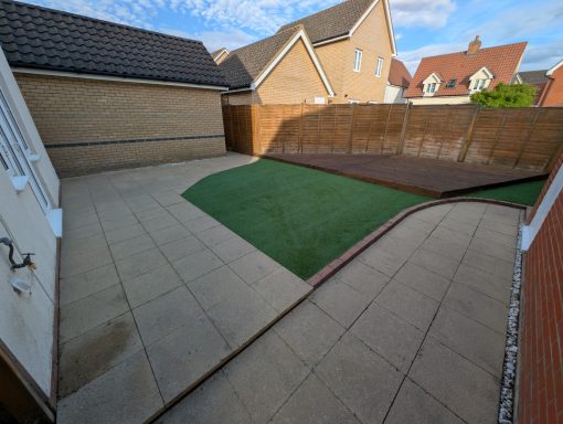 New artificial turf and restored decking after garden refresh