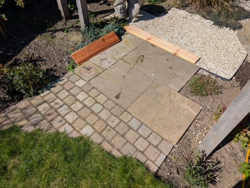 Patio paving and setts before pressure washing in Bury St Edmunds, Suffolk