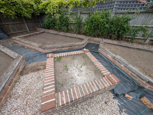 Ground prepared for new weed membrane and gravel