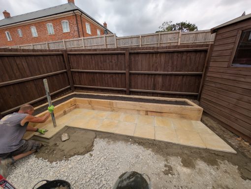 Patio being carefully cut and installed 